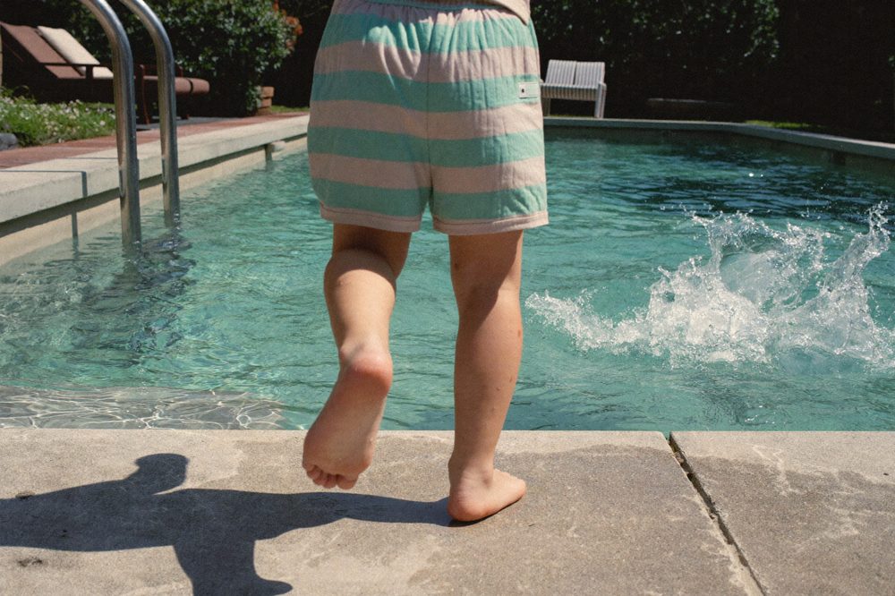 The real win isn't the nail. It's the kid taking his socks off at the pool again.