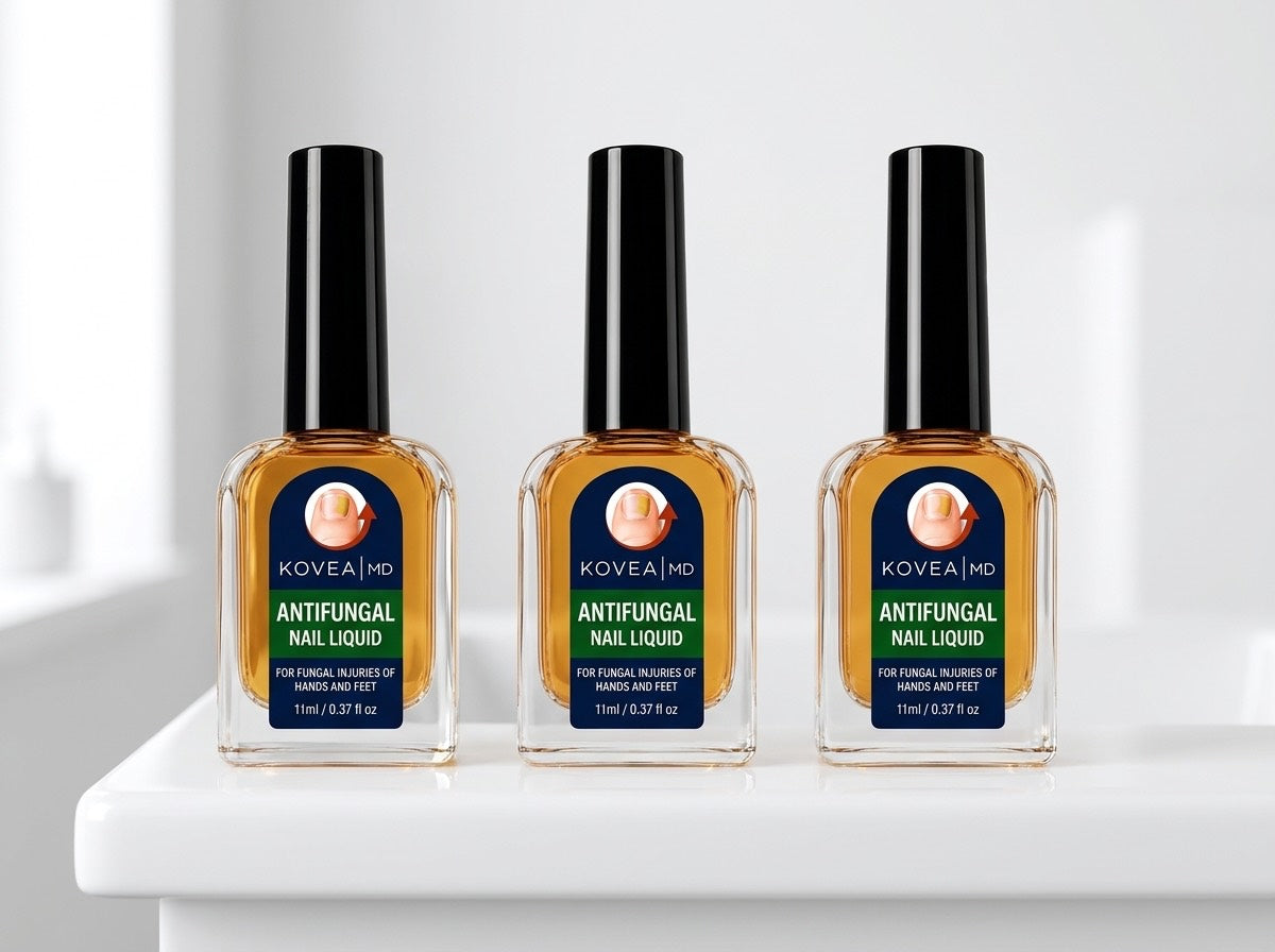 Three bottles of KoveaMD Antifungal Nail Liquid lined up on a bathroom shelf