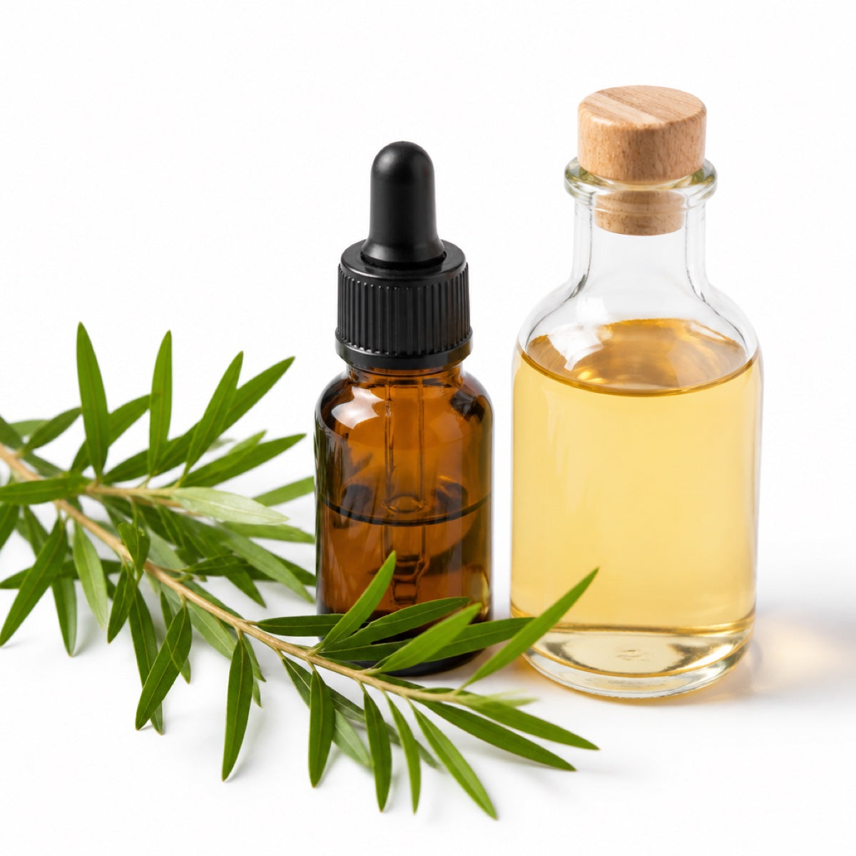 Tea tree oil dropper bottle and apple cider vinegar